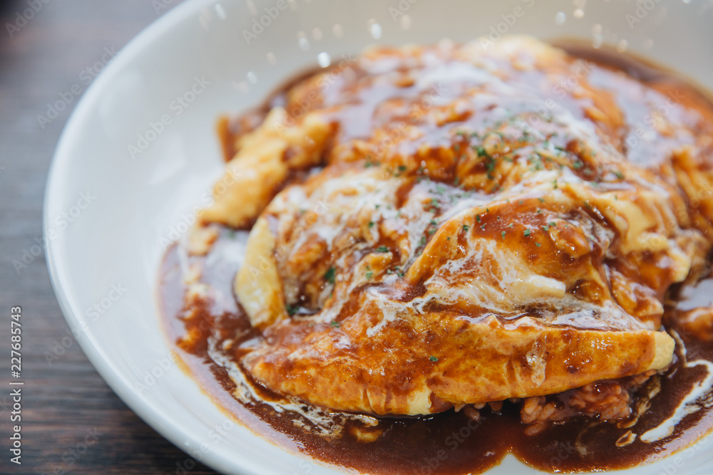 Curry rice with omelet Japanese style on wood background film vintage style Curry rice with omelet Japanese style on wood background film vintage style