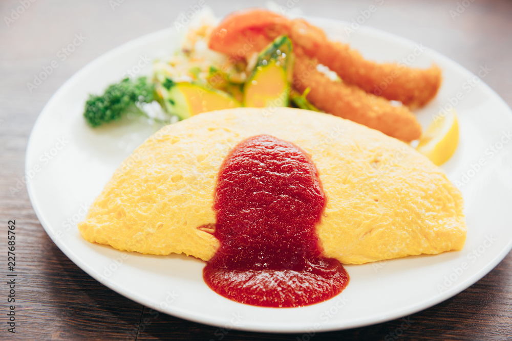 fried rice omelette on top and shrimp tempura japanese food style fried rice omelette on top and shrimp tempura japanese food style