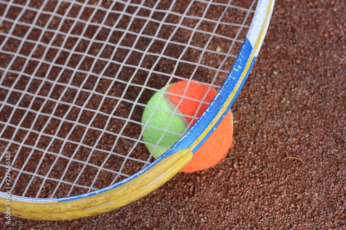 Tennis ball and tennis racket on the court. © dorotaam