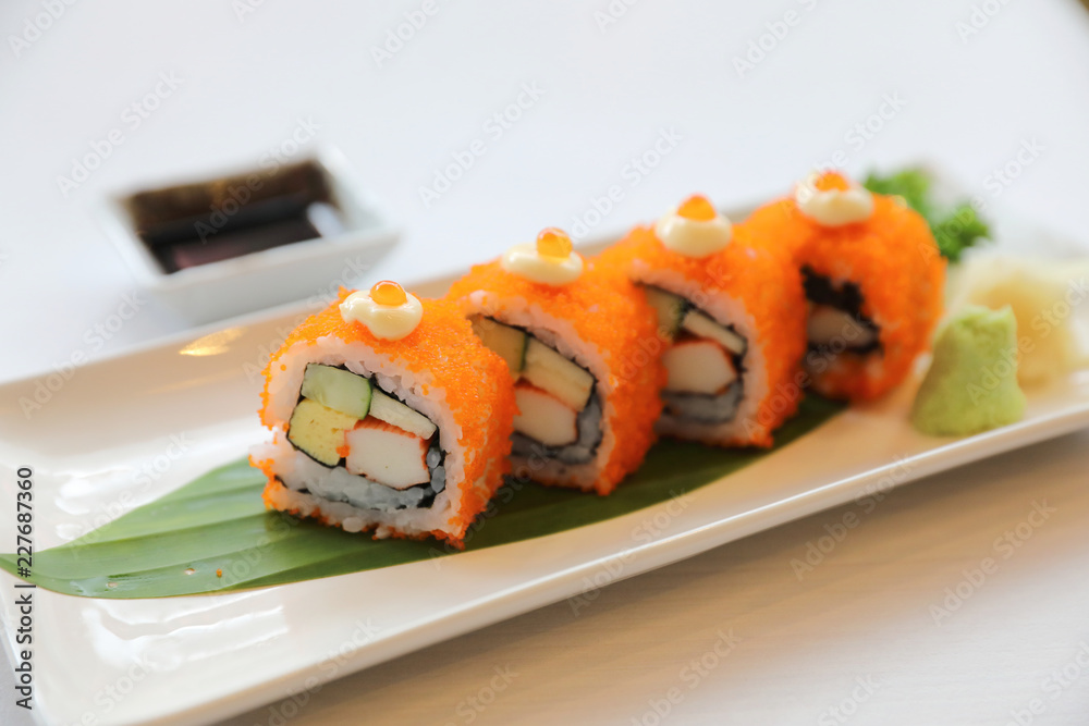 California rollsl sushi with egg cucumber avocado cream cheese red caviar Sushi menu. Japanese food. American style California rollsl sushi with egg cucumber avocado cream cheese red caviar Sushi menu. Japanese food. American style