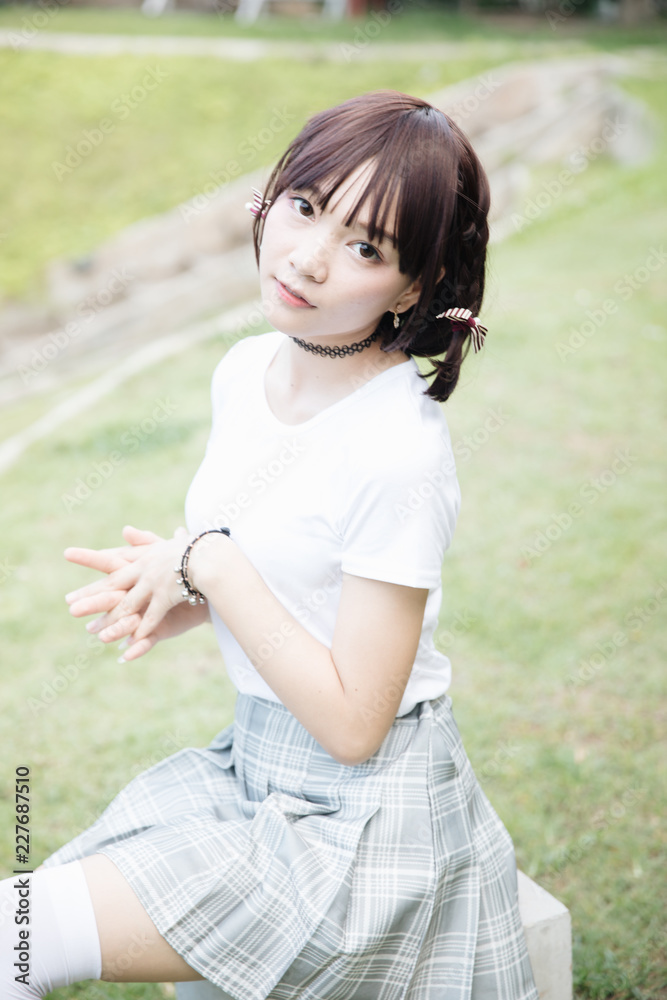 portrait of asian girl with white shirt and skirt looking in outdoor nature vintage film style portrait of asian girl with white shirt and skirt looking in outdoor nature vintage film style