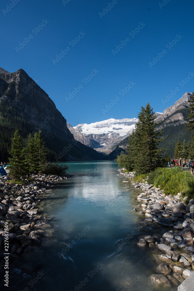 Mid Morning at Lake Louise in Banff National Park in the Canadian Rockies - Alberta Canada. Teal color to the water