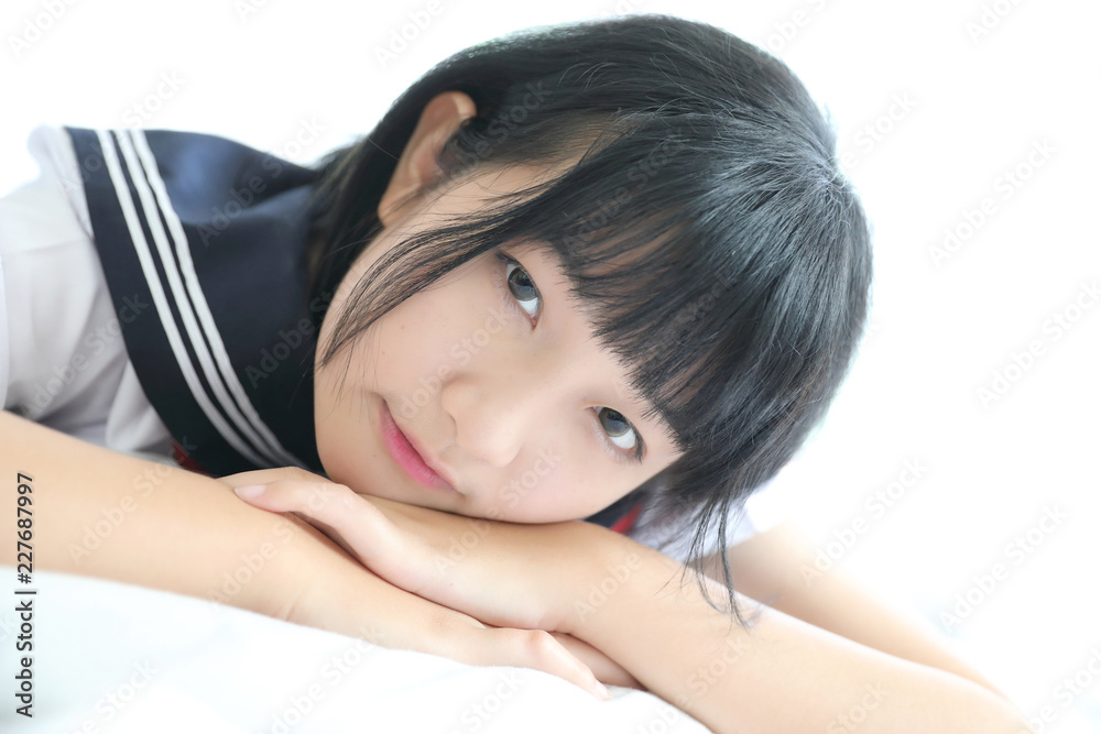 Portrait japanese school girl in white tone bed room Portrait japanese school girl in white tone bed room
