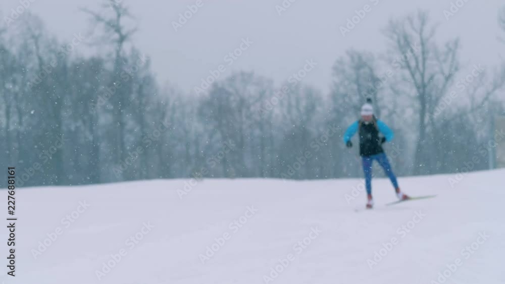 An athlete skies on a track, close up. An athlete skies on a track, close up.