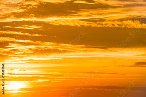 Orange sunset sky with clouds for nature background © Pavlo Vakhrushev
