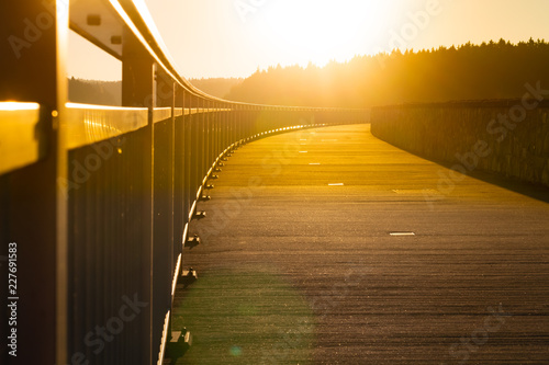 Fototapeta Naklejka Na Ścianę i Meble -  sunset over a bridge