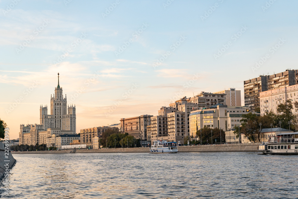 Moscow river evening panorama with a city skyline and Stalin's skyscraper in the background