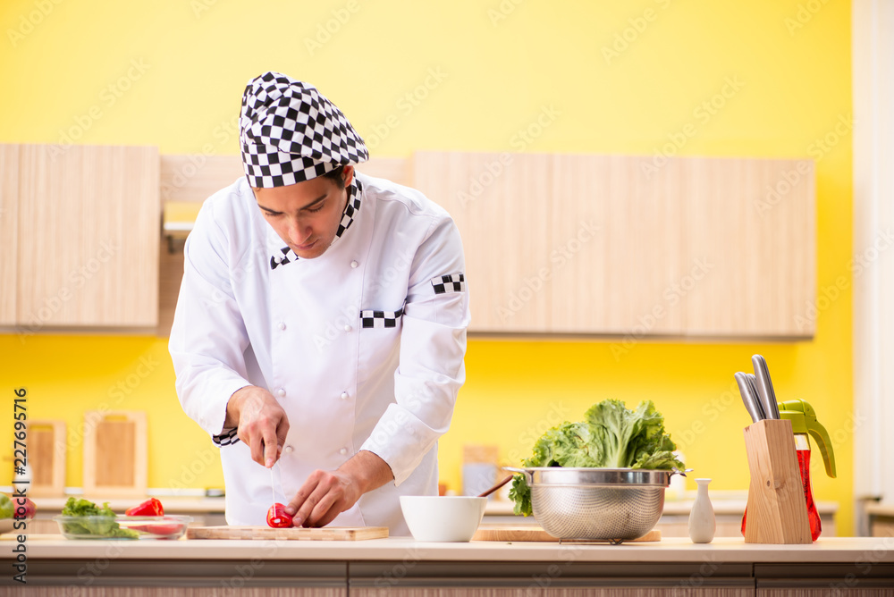 Young professional cook preparing salad at home Young professional cook preparing salad at home