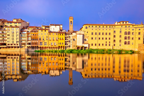 Arno river waterfront morning reflections in Florence