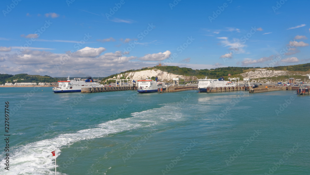 Three ferries at the port of Dover on a sunny day.