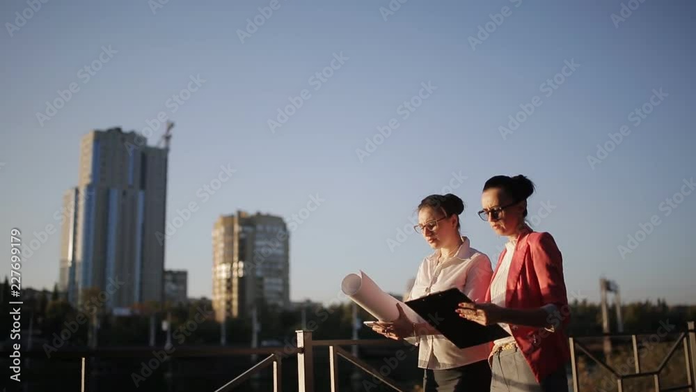 Two women architect to choose the place for construction. Two women architect to choose the place for construction.