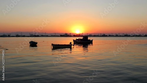 Boats in the sea at sunset. Port background slow motion photo