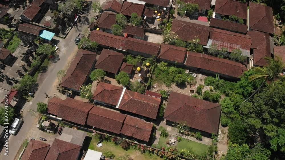 4K aerial view of traditional balinese houses. Flying over balinese village. Bali island. 4K aerial view of traditional balinese houses. Flying over balinese village. Bali island.
