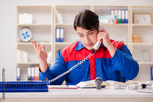 Worker in uniform working on project