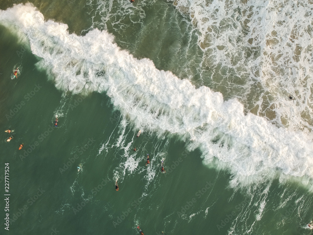 Aerial view of waves with people surfing, Surf. Drone Photography