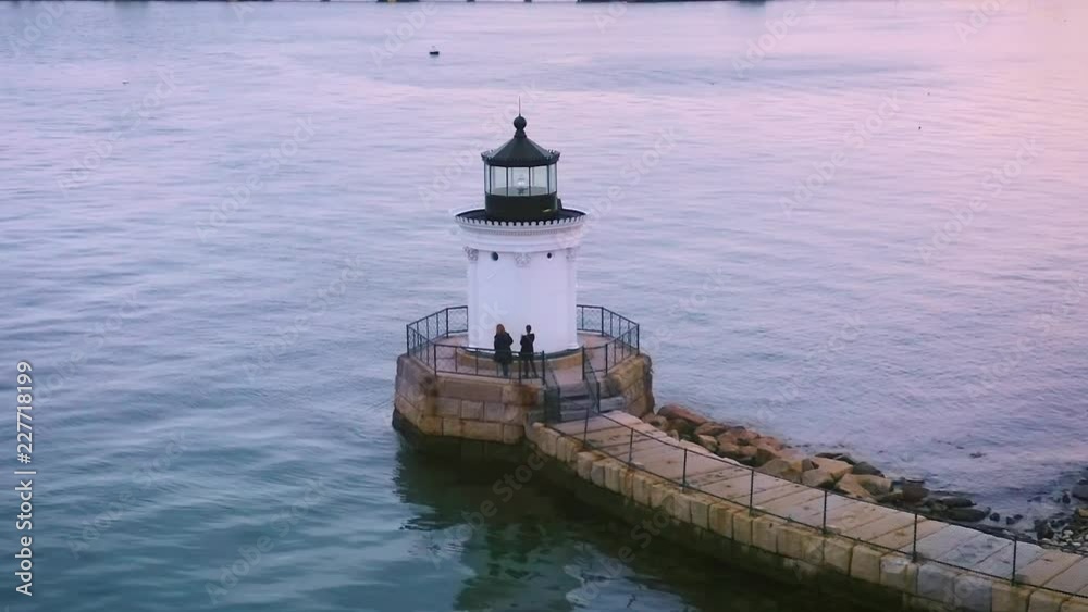 Aerial view of Bug Light, in Portland Maine, with helix camera movement around the point of interest.