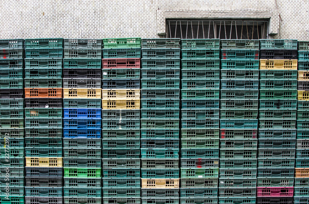 Rows of green, yellow orange and red racks outside an egg store. Rows of green, yellow orange and red racks outside an egg store.