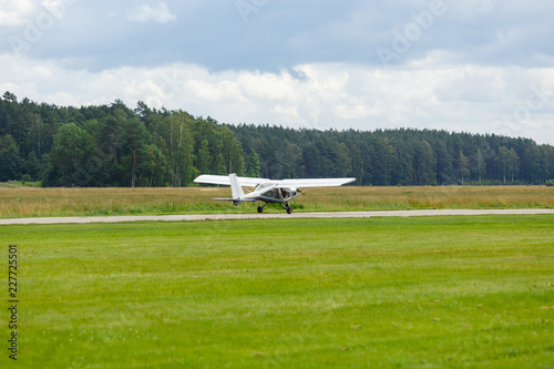 outdoor shot of small plane taking off