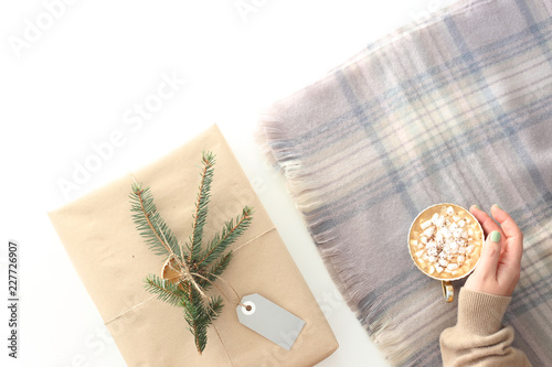a Christmas present on a white background. Winter days concept. Top view, flat lay
