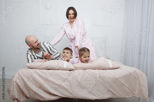 Family in pajamas in bed