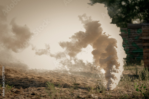 Smoke grenade explosion on polygon during lasertag game