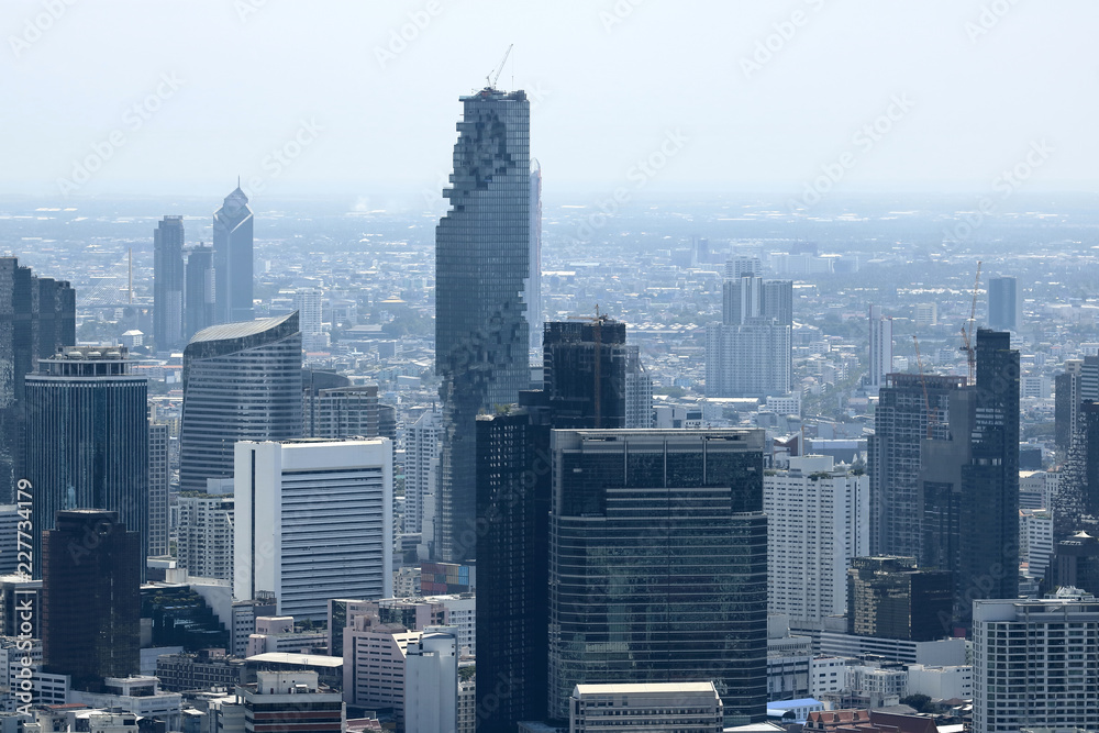 Fototapeta premium Aerial view of modern skyscrapers in Bangkok city
