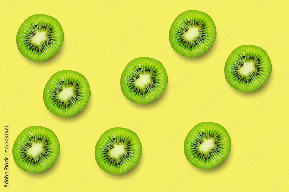 Slice of green raw kiwi fruit pattern background Slice of green raw kiwi fruit pattern background