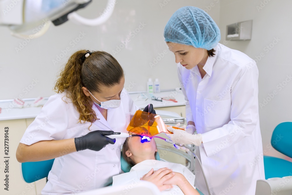 Young patient in dental chair. Medicine, dentistry and healthcare concept Young patient in dental chair. Medicine, dentistry and healthcare concept