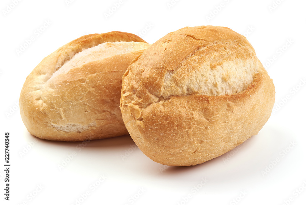 Freshly baked crispy bread rolls, close-up, isolated on a white background.
