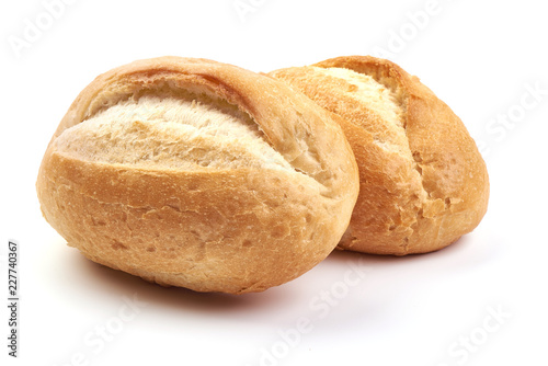 Freshly baked crispy bread rolls, close-up, isolated on a white background.