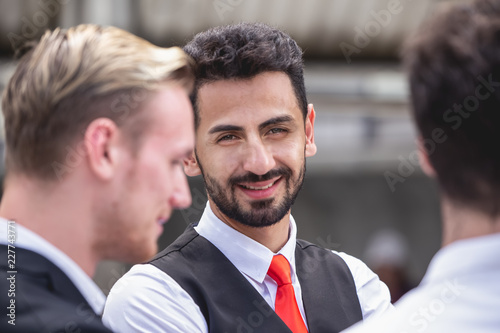 businessman hispanic smile looking camera when talking with partner happy smiling positive business worker concept.