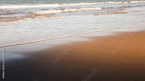 Beautiful soft contrast of light and shadow on a beach