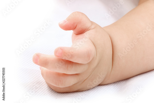 baby boy's hand on white background