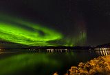 Amazing view of aurora borealis ( northern lights) over Norvegian sea . 