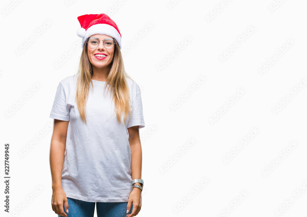 Young beautiful woman wearing christmas hat over isolated background with a happy and cool smile on face. Lucky person.