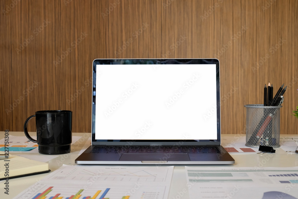 Mockup Comfortable laptop computer with business report paper coffee and other office supplies. Mockup Comfortable laptop computer with business report paper coffee and other office supplies.