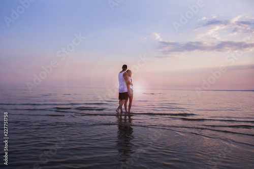 Young couple in love resting on the sea