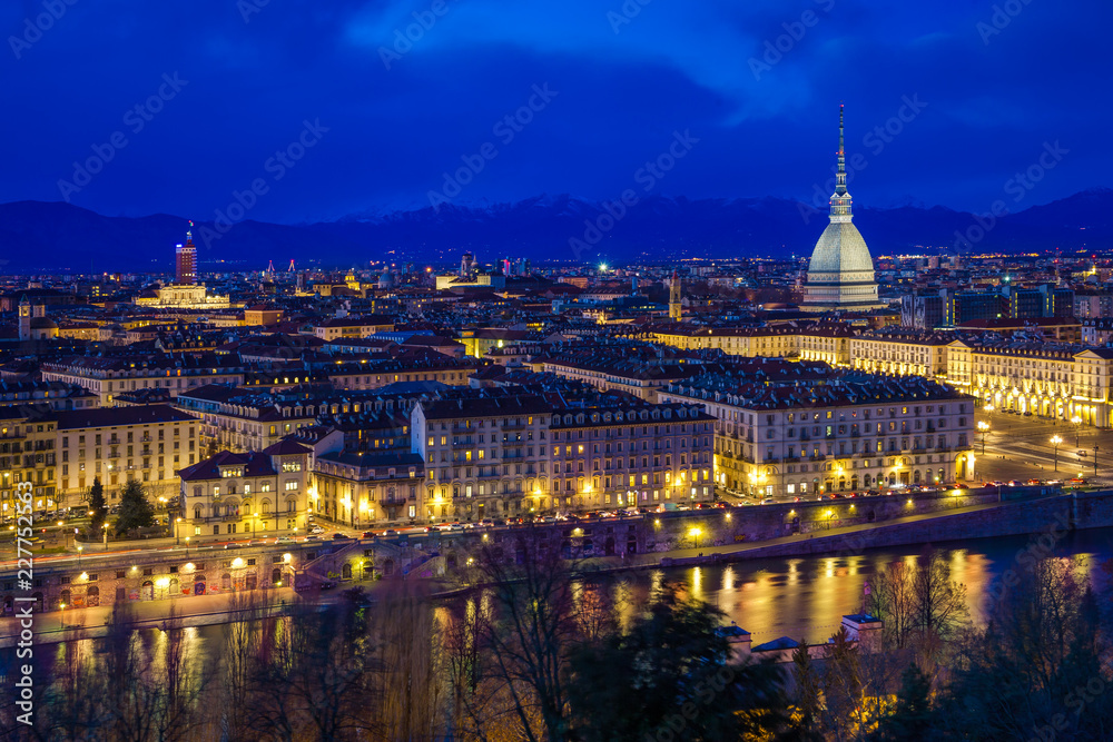 Panoramic view of Turin with Mole Antonelliana against snow capped Alps at dusk, Turin, Italy
