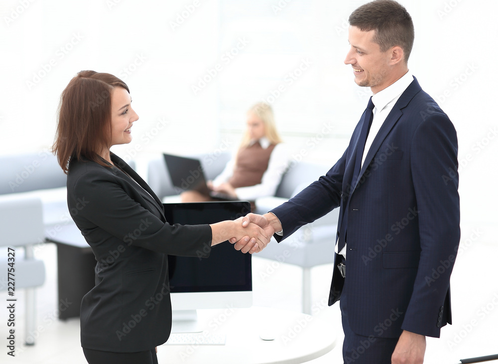 handshake business partners at the negotiating table. handshake business partners at the negotiating table.