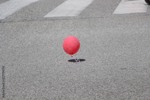 Lost red ballon and crosswalk