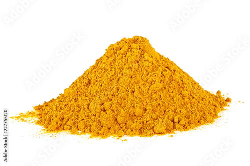 Pile of powder from turmeric root isolated on white background. Organic food.