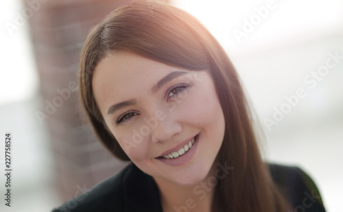 close up portrait of young business woman in modern office