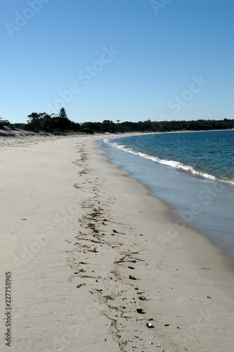 Small breaking waves on a deserted beach