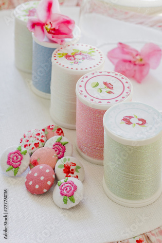 Embroidered buttons and pastel spools