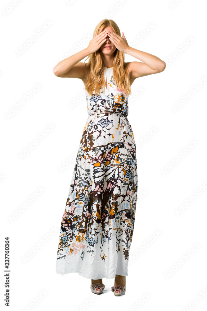 Blonde young girl in a summer dress covering eyes by hands. Do not want to see something on isolated white backgroun Blonde young girl in a summer dress covering eyes by hands. Do not want to see something on isolated white backgroun