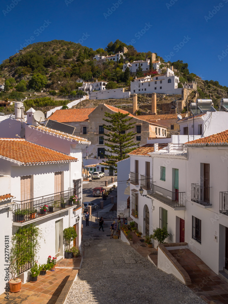 A typical street in the hillside village of Frigiliana in Andalusia Spain