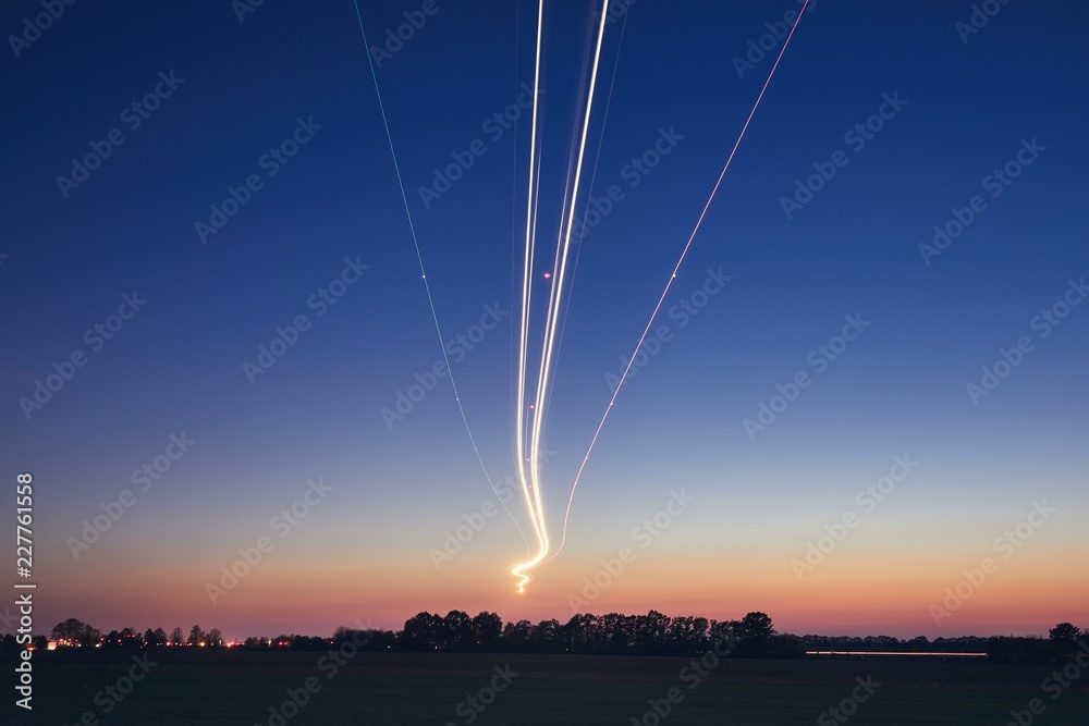 Fototapeta premium Light trails of airplane during landing