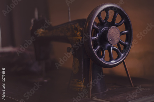 Vintage sewing machine on dark background