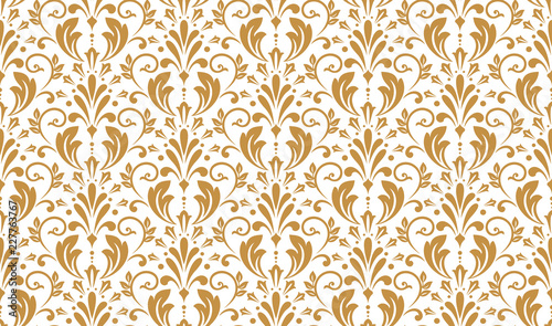 Wallpaper in the style of Baroque. Seamless vector background. White and gold floral ornament. Graphic pattern for fabric, wallpaper, packaging. Ornate Damask flower ornament
