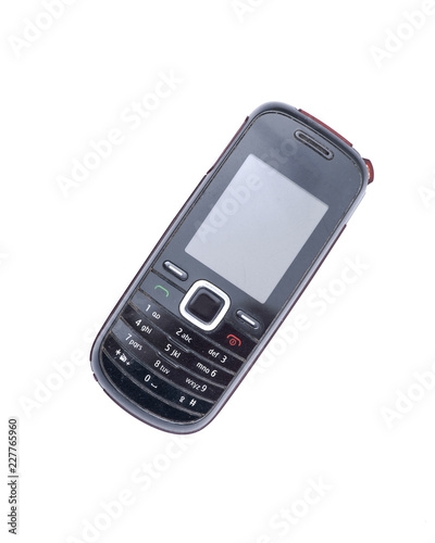 Old Used retro cell mobile phone isolated on white background